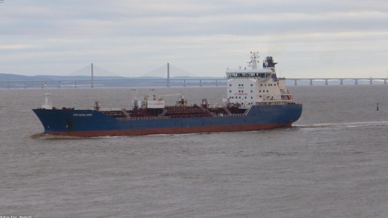 Oil tanker docked at an illuminated port